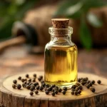 homemade black pepper oil recipe bottle with peppercorns
